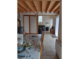 The sliding door to the living room is half closed.