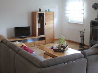 LandLeben-Wohnzimmer mit Kaminofen
