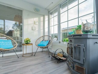 Der Wintergarten mit Kamin