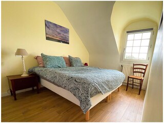 Schlafzimmer 1 mit einem Doppelbett