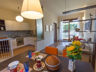 Dining area and fully equipped kitchen.