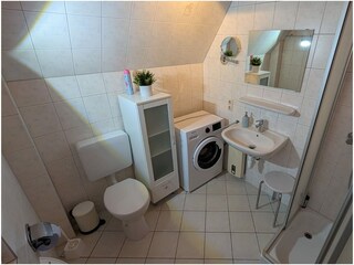 Duschbad mit Waschmaschine