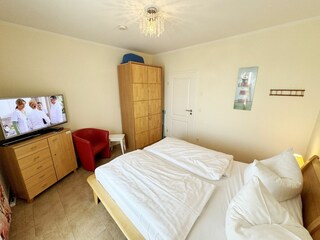 Schlafzimmer mit Sitzmöglichkeit