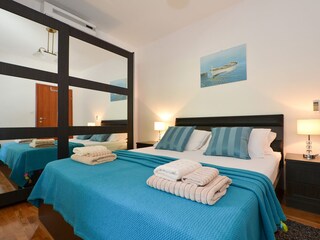 Bedroom with double bed  and extra bed