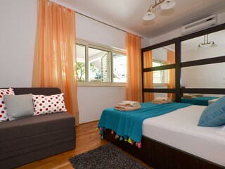 Bedroom with double bed and extra bed