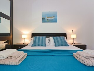 Bedroom with double bed and extra bed