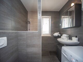 Bathroom with toilet and shower cabin