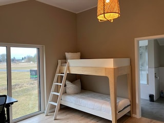 Schlazimmer im EG mit zusätzlichem Hochbett