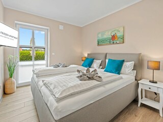 erstes Schlafzimmer mit Doppelbett