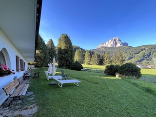 Large, well-kept garden almost surrounding the house