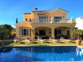 exterior of property with pool & garden