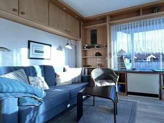 Wohnraum mit direktem Zugang zum grossen Übereckbalkon