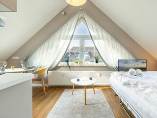 Wohnzimmer mit Schlafsofa