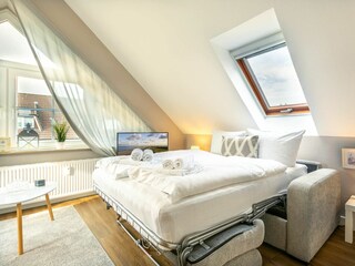 Wohnzimmer mit Schlafsofa