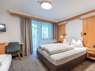Dreibettzimmer mit Balkon