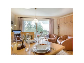 Wohnzimmer mit Essbereich  in 2-Zimmer-Ferienwohnung im Haus Atlantis,  Strandpromenade 19, St. P...