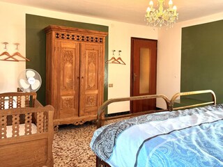 double bedroom with cot