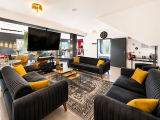 Living area with big tv and much space for relaxing