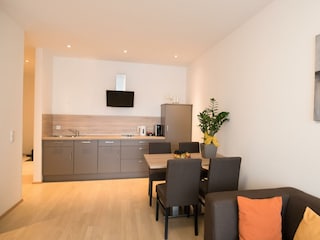 Hotel Vitus Sitzbereich mit Küche