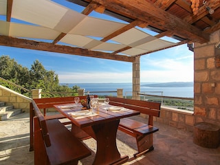 Überdachte Terrasse mit Meerblick