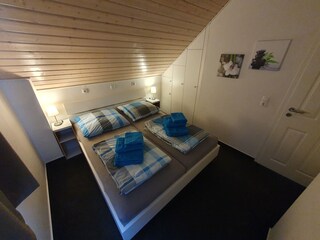Obergeschoss Schlafzimmer 2 (Wäschepaket buchbar)