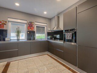 Modern kitchen with built-in appliances at Villa Ravina