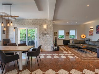 Open-plan dining and living area with terrace access