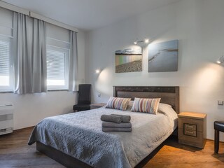 Bright double bedroom with air conditioning