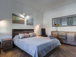 Spacious double bedroom with contemporary furnishings