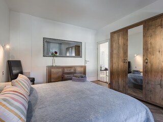 Comfortable double bedroom with ample wardrobe storage
