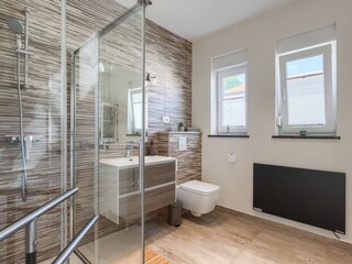 Contemporary bathroom with spacious glass shower