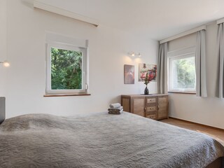 Bright double bedroom with garden views and A/C