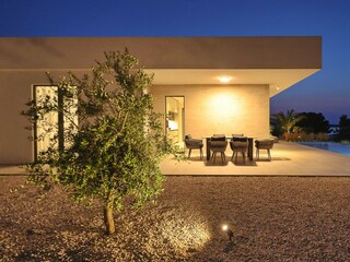 Courtyard with a covered dining tablof Villa D5, Pašman