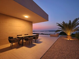 Covered outdoor dining area with sea view, Villa D9