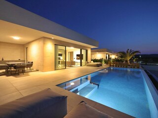 Modern villa with pool and outdoor dining area
