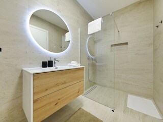 Modern bathroom with walk in shower in villa