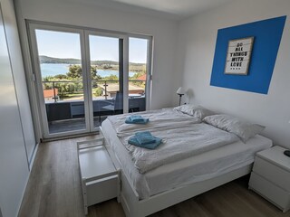 Bedroom with balcony and sea view in villa