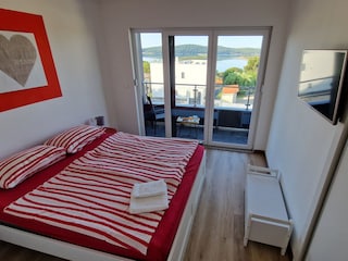 Comfortable bedroomwith TV and balcony in villa