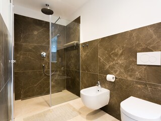 Bathroom with walk in shower and toilet