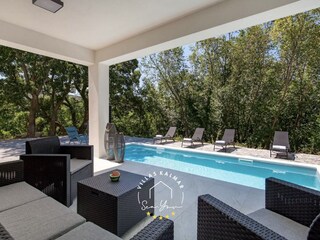 Lounge area next to private pool