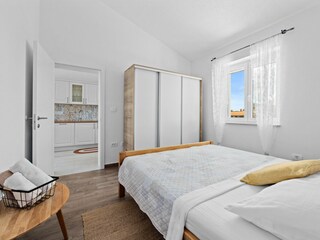 Comfortable bedroom with closet