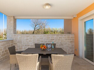 Outdoor dining area on the terrace of villa