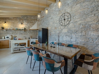 Open-plan kitchen and dining area with rustic charm