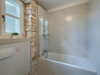 Bathroom with bath tub in villa