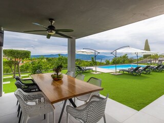 covered outdoor dining area with sea view
