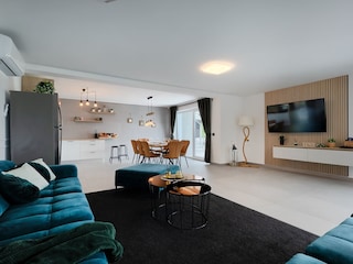 open concept living area with kitchen and dining table