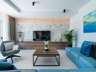 Living area with SAT TV and direct terrace access