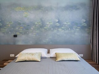 Bedroom with double bed in Villa in Pula