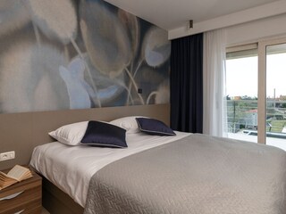 Bedroom with double bed in holiday home in Pula