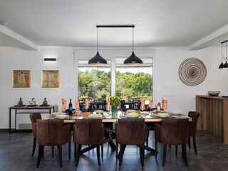 Modern dining area with forst view in Villa